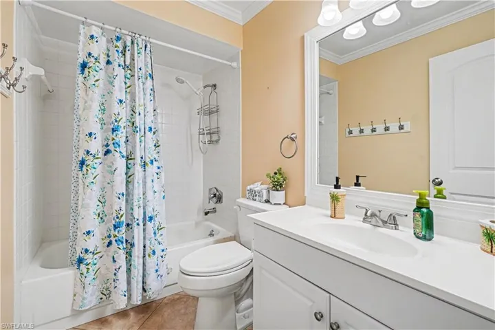 Guest bathroom with tiled flooring.