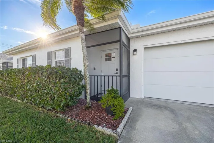 Property entrance featuring 2 car garage
