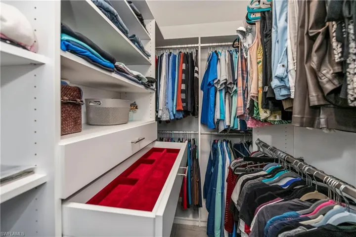 All closets have custom shelving and storage, this is the closet off primary bedroom
