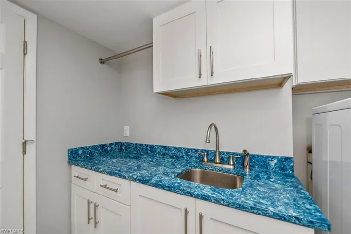 Custom Designed Laundry Room with hanging space