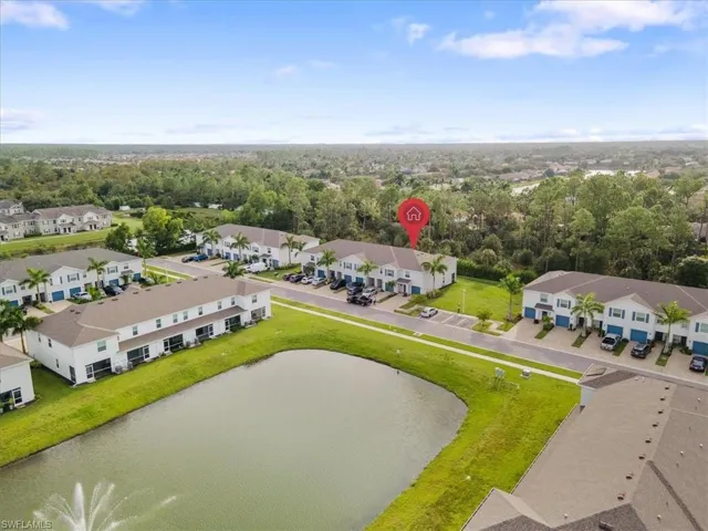Aerial view of residential area with a nearby body of water