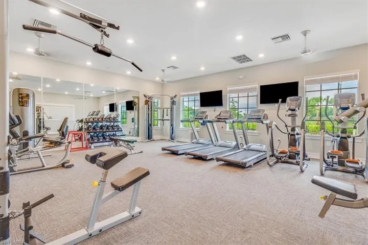 Exercise room featuring recessed lighting