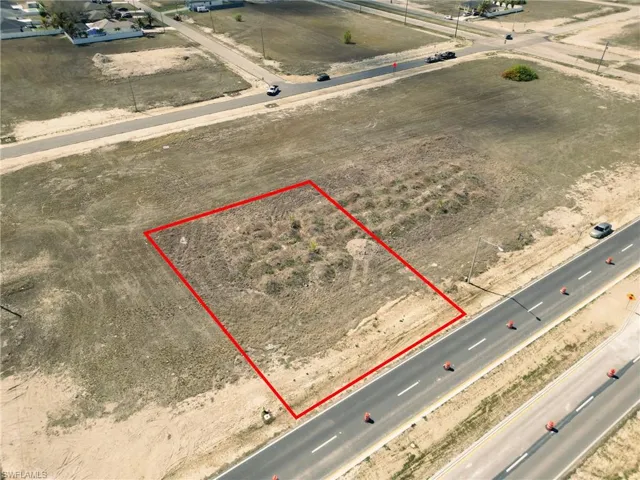 Aerial view of sparsely populated area featuring property boundaries highlighted