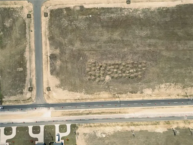 Aerial view of property and surrounding area featuring rural landscape
