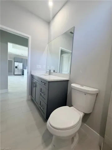 Bathroom with vanity and light tile patterned floors