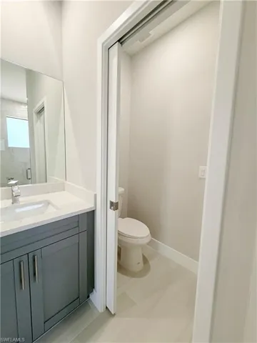 Bathroom with vanity and a stall shower