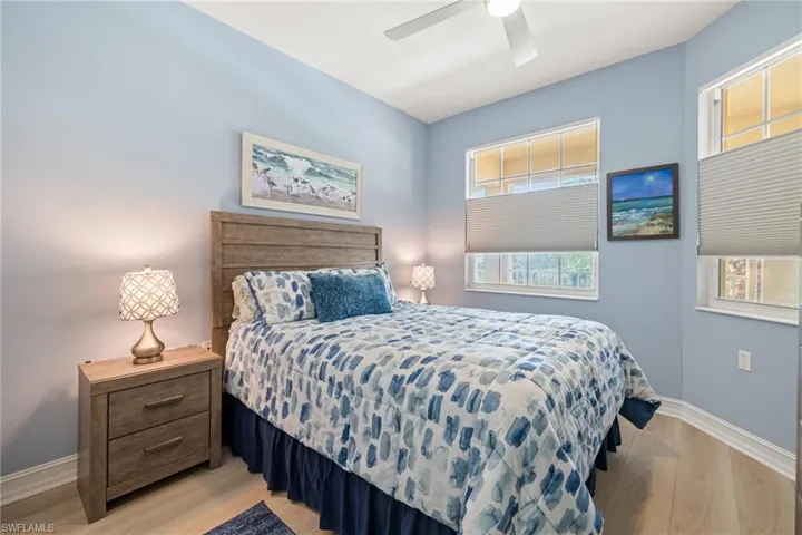 Guest bedroom with queen bed set included in sale