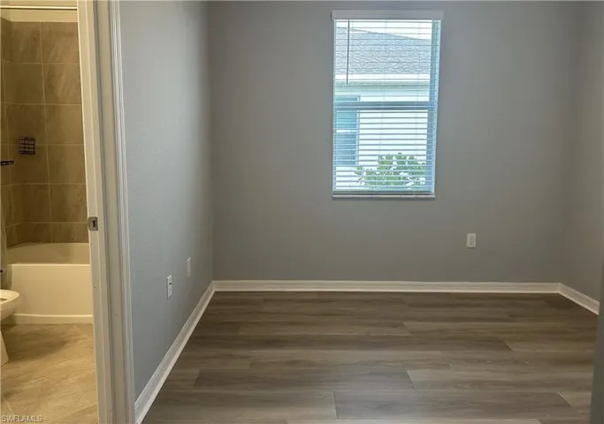 Unfurnished room with wood finished floors