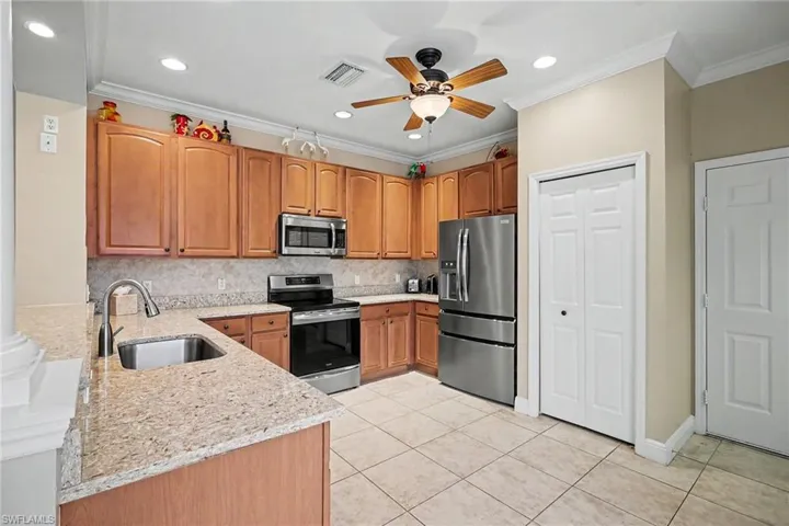 Kitchen features Wood Cabinetry & Pantry!