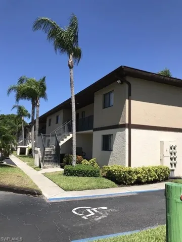 View of apartment building / complex featuring stairs