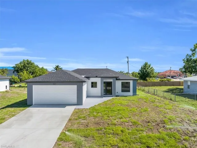 **Previous Model Photo** View of front of property with a 2 car garage