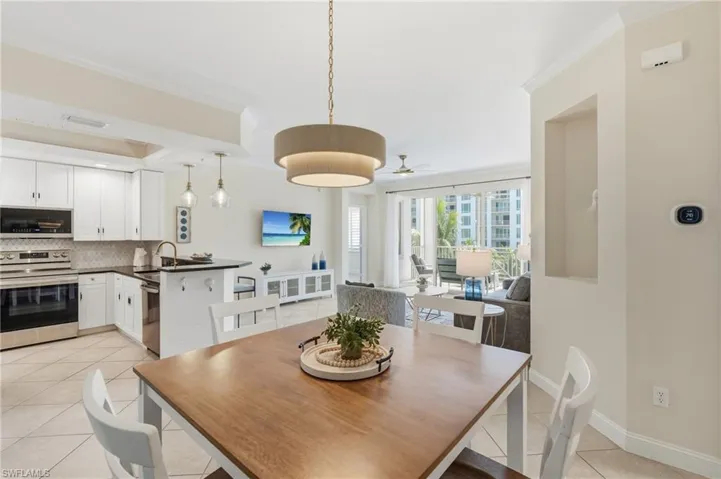 Open-concept living area with tile flooring and a neutral color palette