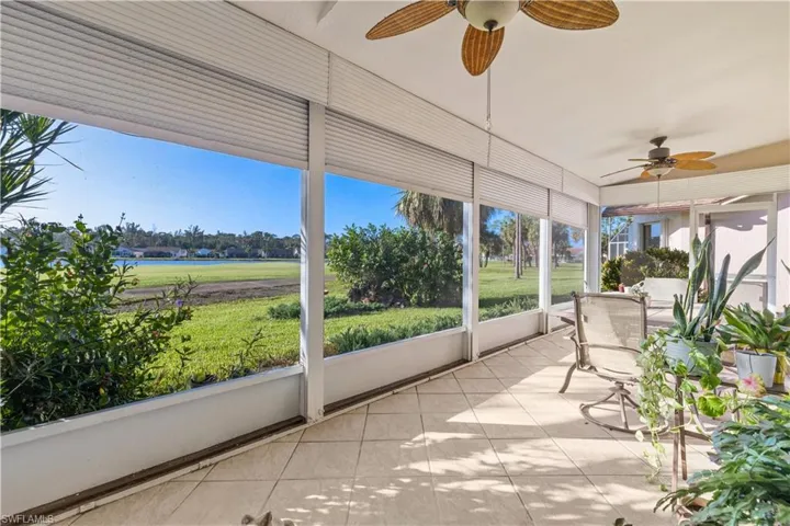 sun room/lanai featuring ceiling fan tiled area