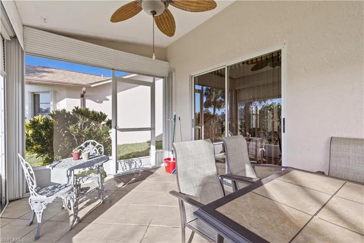 Sunroom featuring lofted ceiling and ceiling fan
