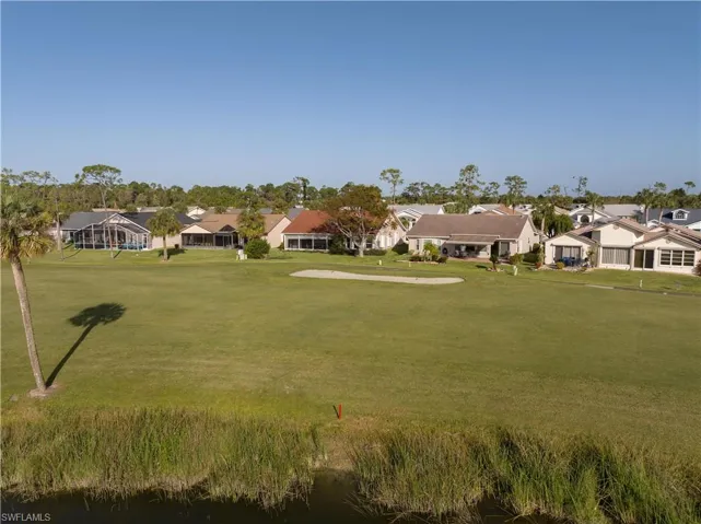 View of home's community featuring a yard and a water view