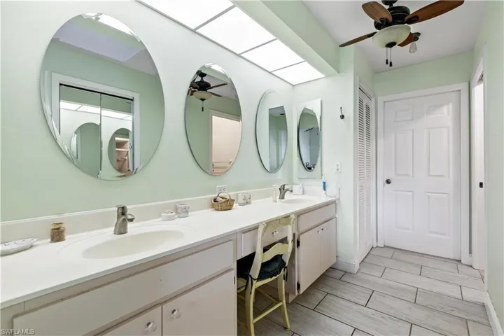 Bathroom featuring vanity and ceiling fan