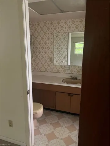 Bathroom with vanity and toilet