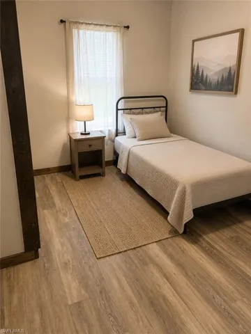 Neutral wall tones complemented by wood-finish flooring