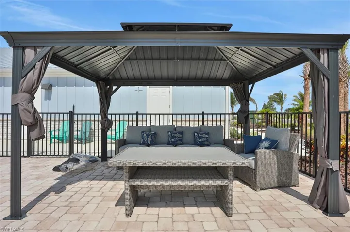 View of patio / terrace with a gazebo and outdoor furniture