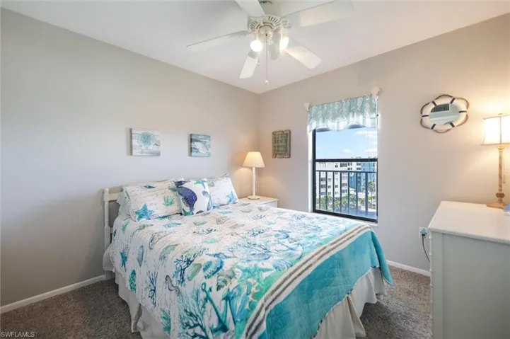 Bedroom with carpet and ceiling fan