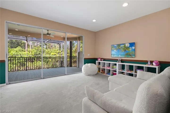 Living area featuring recessed lighting, a ceiling fan, and carpet floors