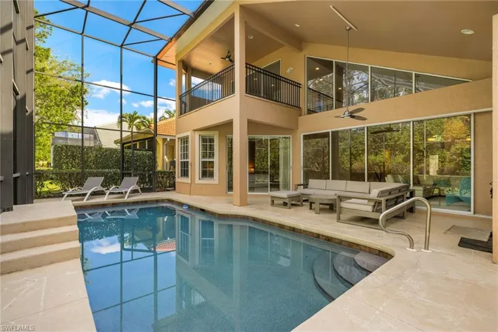 Pool with a patio area, ceiling fan, an outdoor hangout area, and a lanai