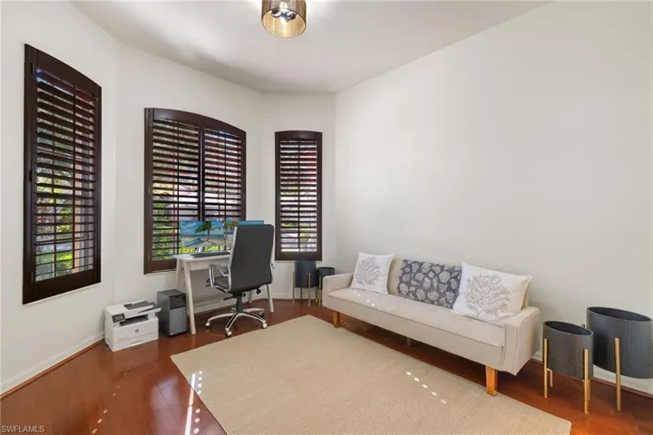 Office area with wood finished floors and baseboards