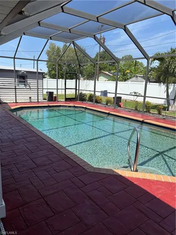 View of pool with a fenced backyard, a lanai, a patio area, and a fenced in pool