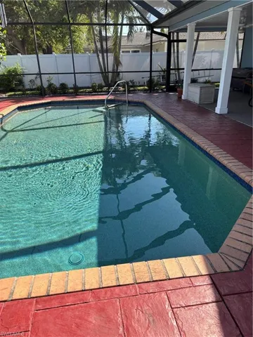 View of pool with a fenced in pool, a patio, and fence