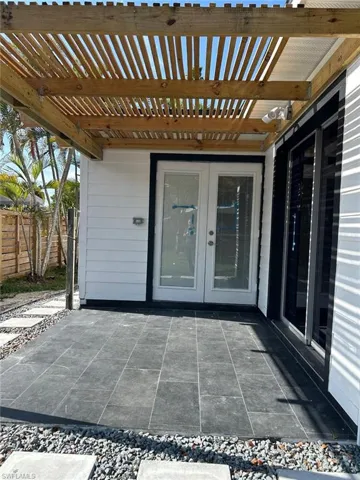 View of patio featuring french doors and a pergola