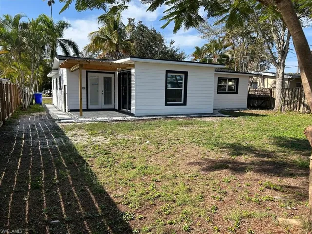 Back of house with a patio and french doors
