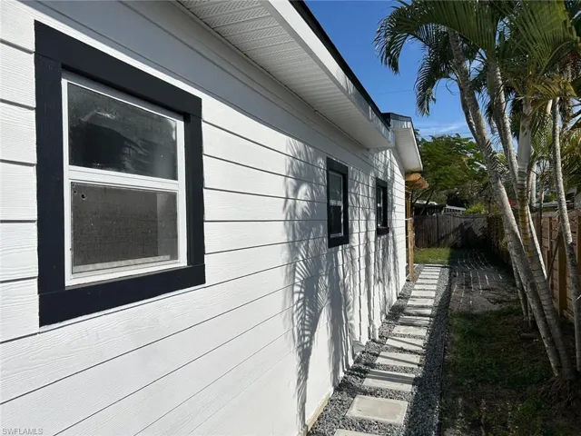 View of property exterior featuring a fenced backyard