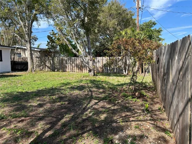 View of fenced backyard