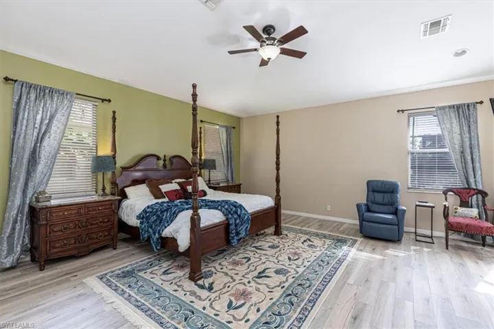 Bedroom featuring a ceiling fan and light wood-type flooring