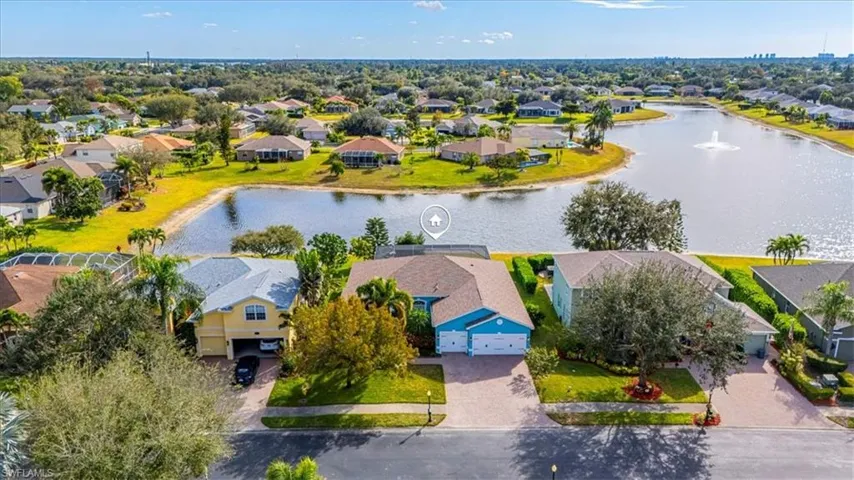 Aerial perspective of suburban area featuring a large body of water
