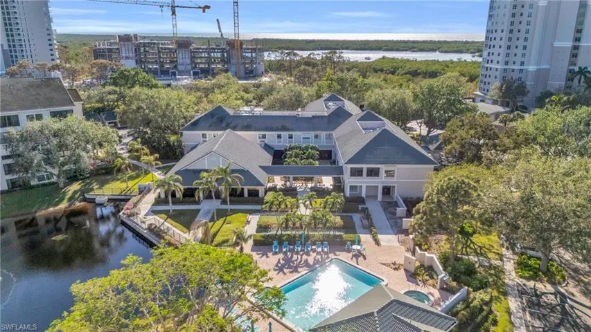Birds eye view of property featuring a water view