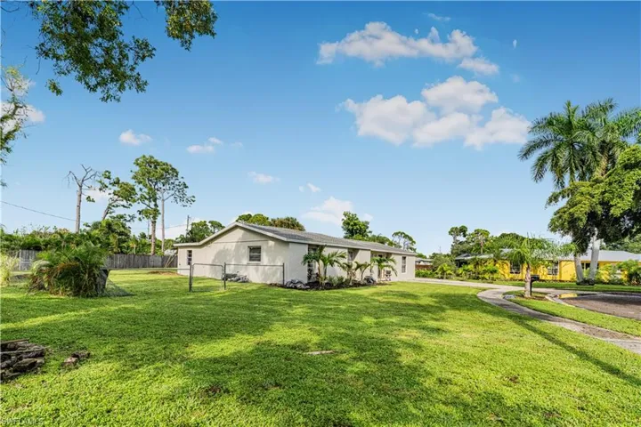 View of yard featuring fence