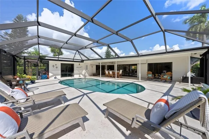 View of pool featuring a lanai and a patio area