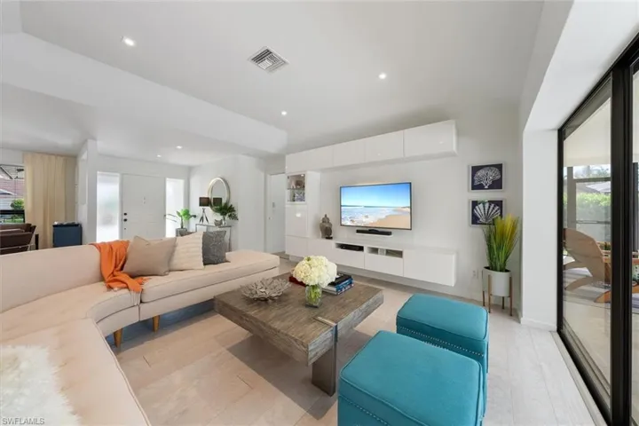 Living room featuring light hardwood / wood-style flooring and plenty of natural light