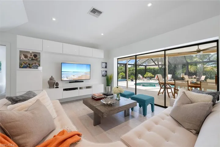 Living room with light hardwood / wood-style flooring
