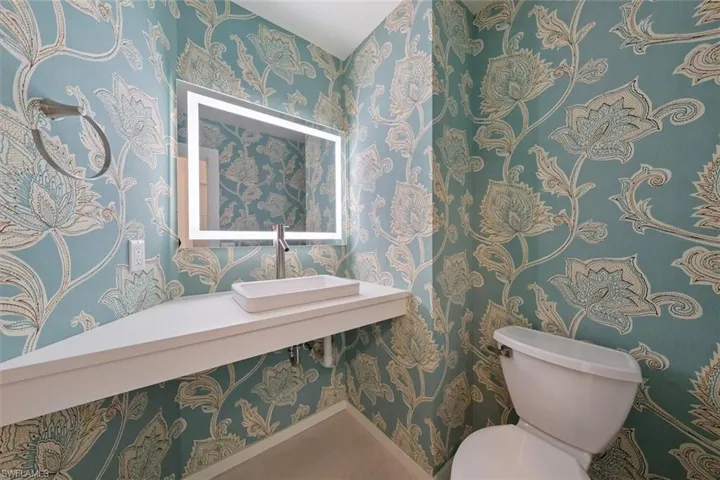 Bathroom featuring sink and toilet