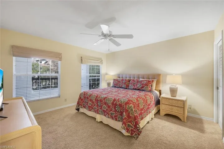 Guest bedroom tucked privately away on the western side of the home, away from the primary suite.