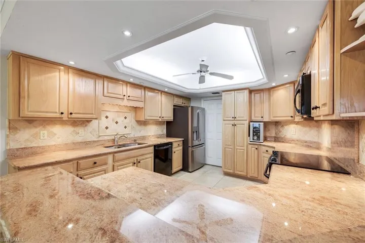Granite countertops and oak cabinetry.