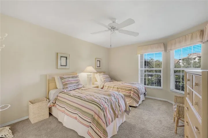 The den, currently being utilized as a bedroom, is accessible from the kitchen and the foyer.