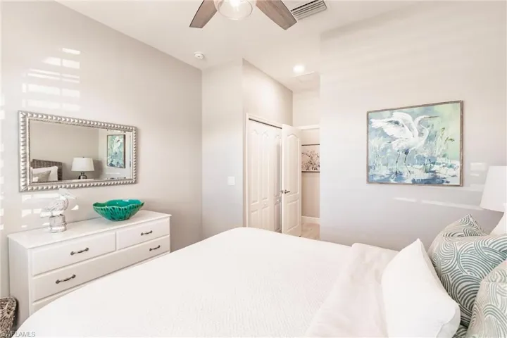 Bedroom featuring ceiling fan and a closet