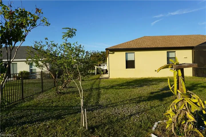 View of home's exterior featuring stucco siding and a shingled roof