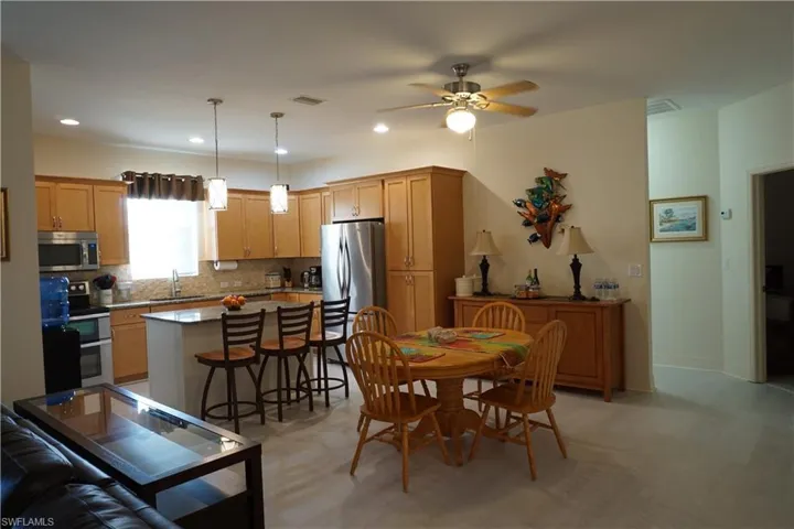 Dining space featuring recessed lighting and a ceiling fan