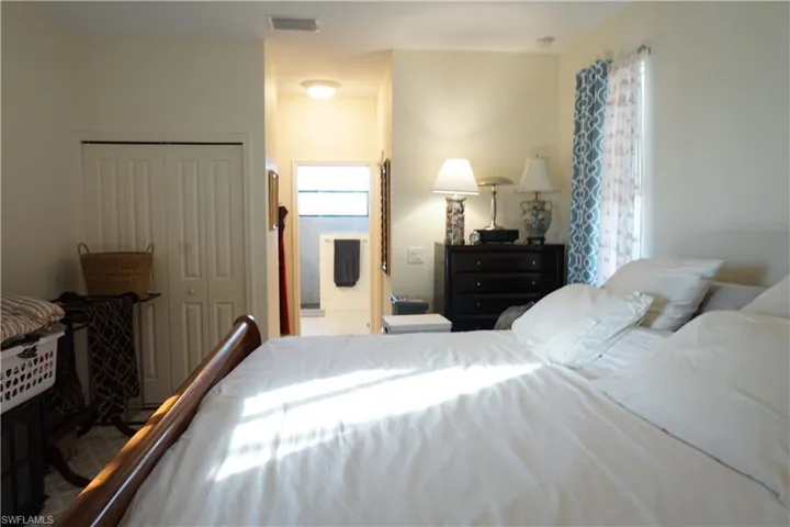 Primary Bedroom with a walk-in closet and ensuite bathroom