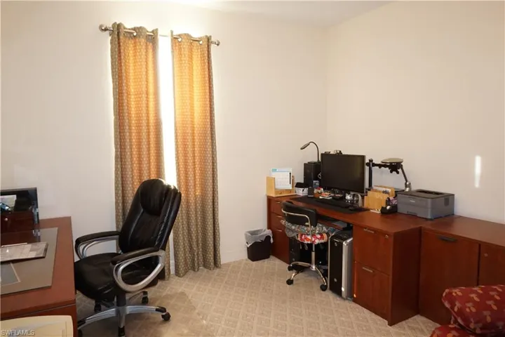 Guest bedroom with light carpet