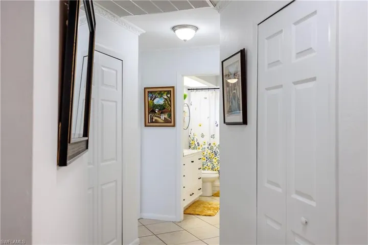 Hallway featuring light tile patterned floors